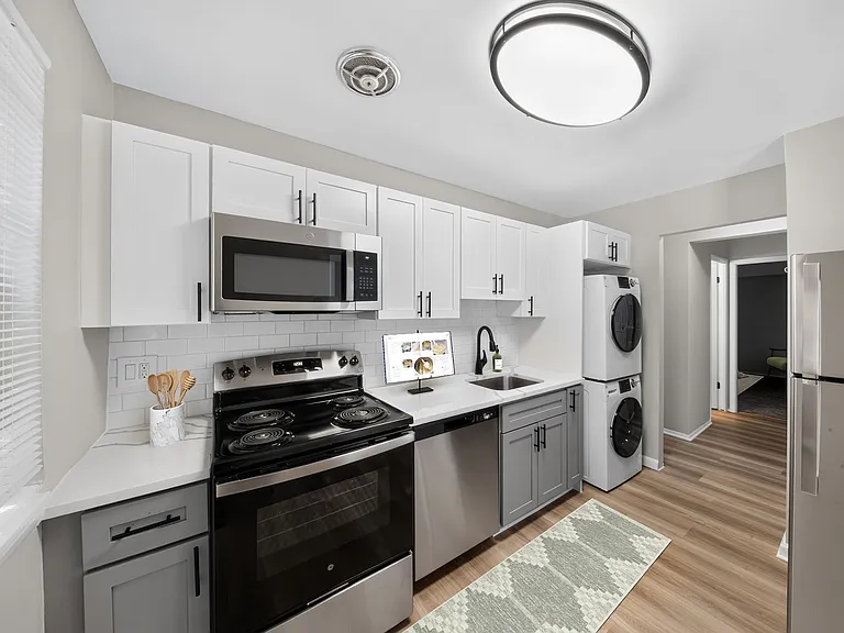 Modern living awaits at Eagle Rock Apartments at Bel Air. This stylish kitchen features sleek stainless steel appliances, ample counter space, and a cozy layout perfect for culinary adventures. Explore your new home today!