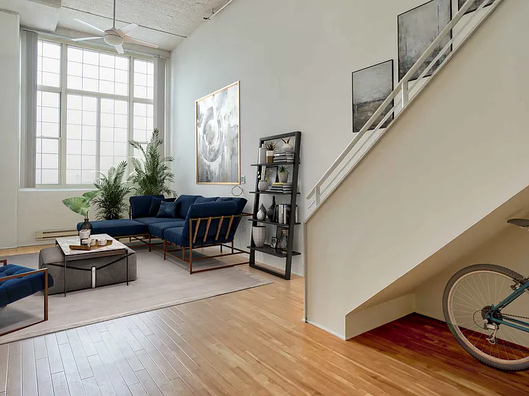 Wood floors throughout the kitchen and living room