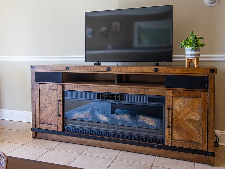 An electric fireplace to keep you warm and a TV with cable to watch your favorite shows.