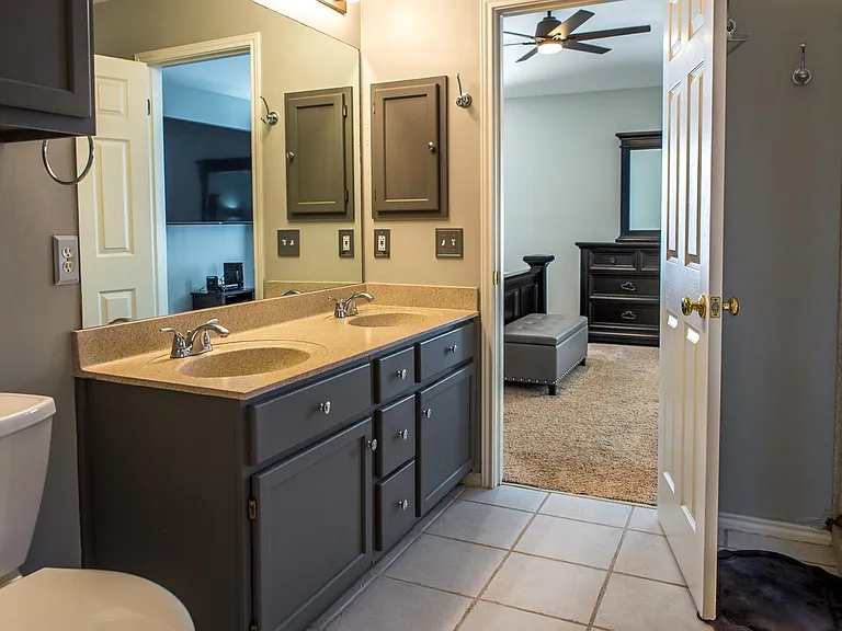Private En-Suite Bathroom Featuring a Double Vanity, Garden Tub, and Separate Shower, Plus an Oversized Walk-In Closet.
