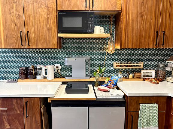 Kitchen, includes single induction cooktop and microwave as pictured. 
Also have a toaster oven available (not pictured)