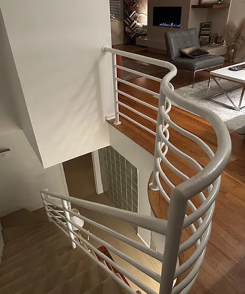 Handrail leading downstairs.