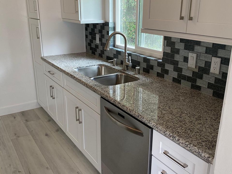 Re-modeled kitchen with granite countertops, stainless steel "Chefs" stove, beautiful cabinets, and the window faces onto nature!