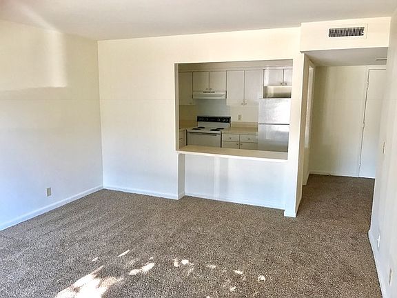 Deluxe living Room with View of Kitchen