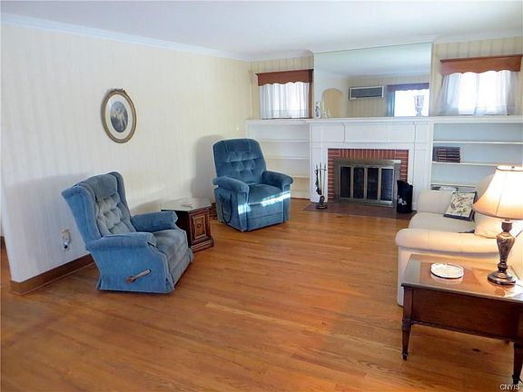 Living Room, with fireplace and bookshelves
