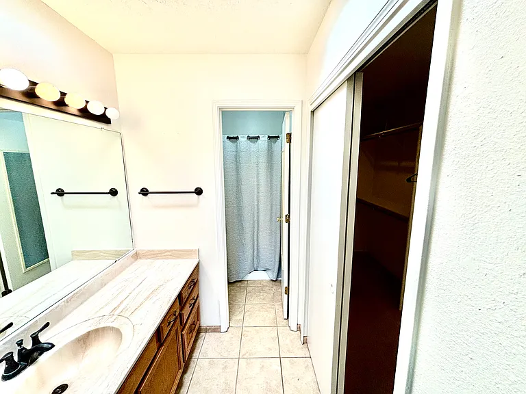 Your private bathroom with walk-in closet to the right