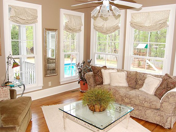 Elegant Sun Room Overlooks Pool and Patio Oasis