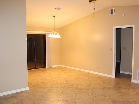 Family room looking at dining room, door on right goes to master, sliding door leads to Florida room.