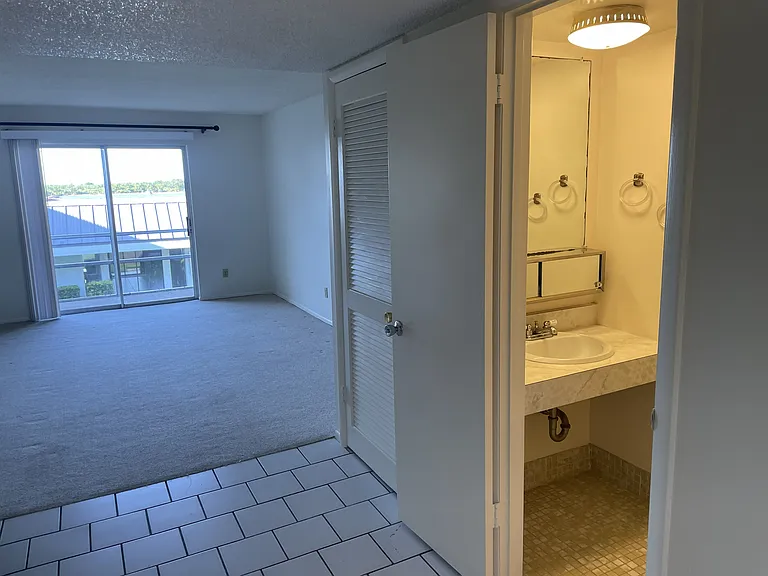 HALF BATH, DINING, LIVING & BALCONY