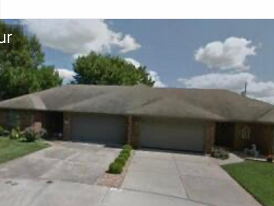 Photo of entire Patio home. Patio home on left side is available for rent. Right side owned by seperate private party. Back yard has privacy fence.