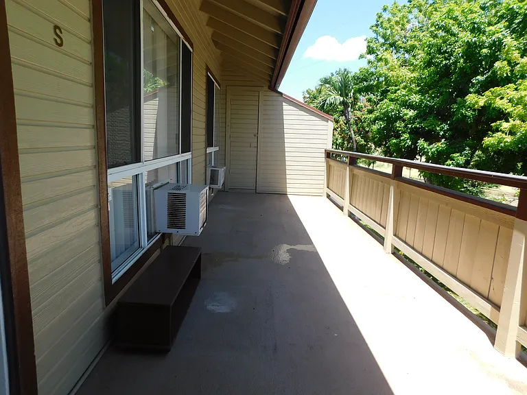 Long lanai with storage closet. Tree-top privacy on the perimeter of the complex