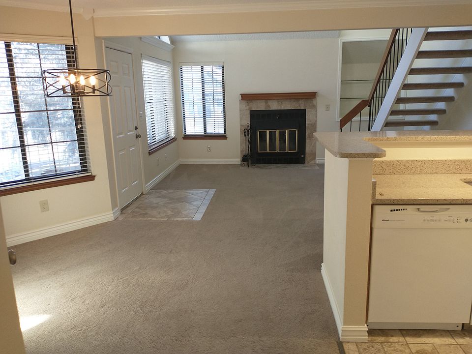 dining and living area. Window treatments are 2" neutral blinds.