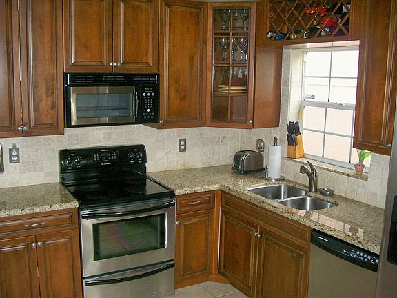 Granite Countertops, New Cherry Stained Cabinets, Stainless Steel Appliances, 