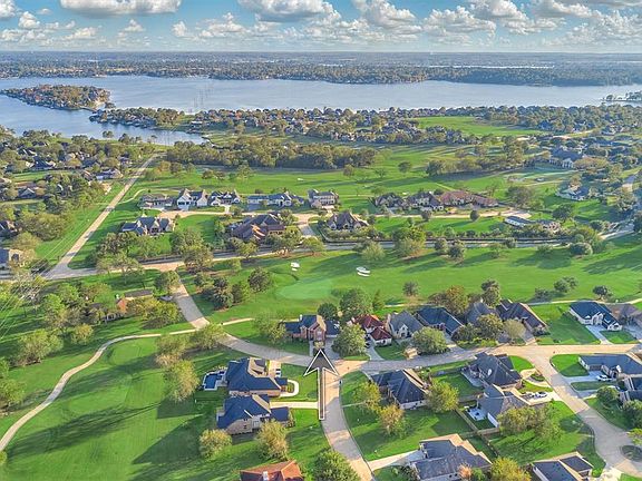 Captivating two-story brick home nestled behind the gates of Bentwater with a scenic view of Weiskopf #2