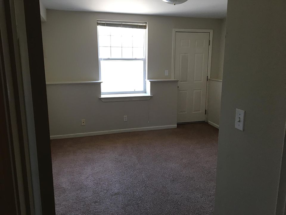 Unfurnished room with direct access to the back patio.