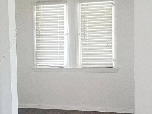 Office with built in bookshelves on opposite wall