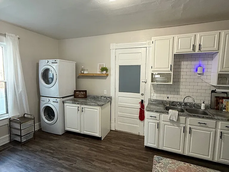 Other side of kitchen. Back patio through this door, great for storage.