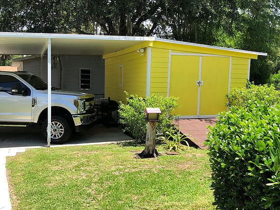 Carport with attach shed