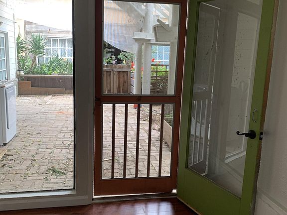 Bedroom two door to backyard