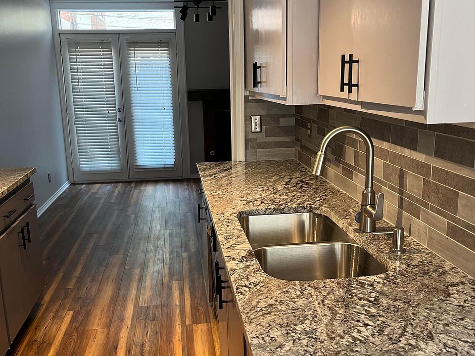 Granite countertops with new sink and kitchen faucet.