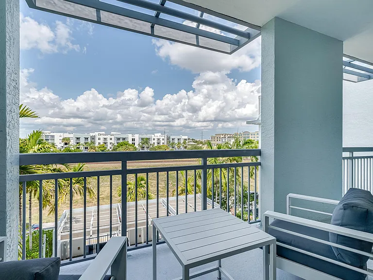 Private Balcony with Seating and Open Sky Views