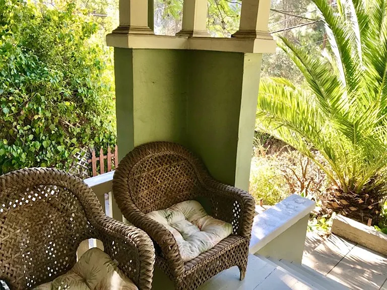 Porch with hillside and meadow views