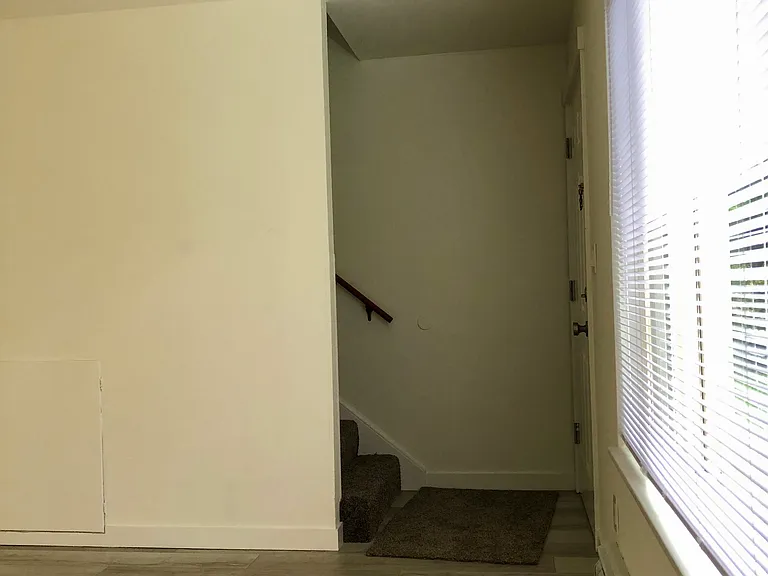 Front entrance and stairs from living room