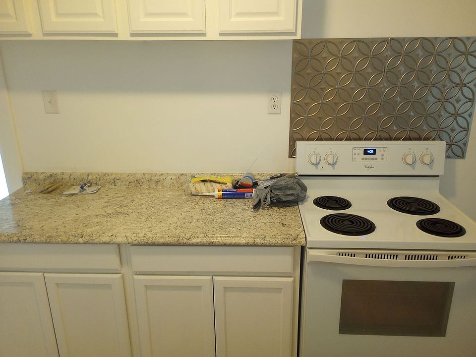 New cabinets, countertops, appliances and flooring in the kitchen
