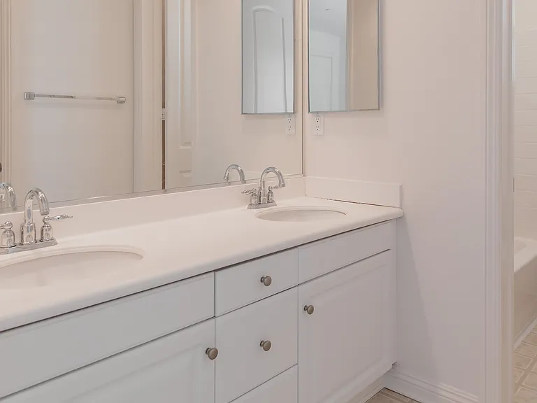 Jack and Jill style bathroom with separate room for toilet and bath/shower