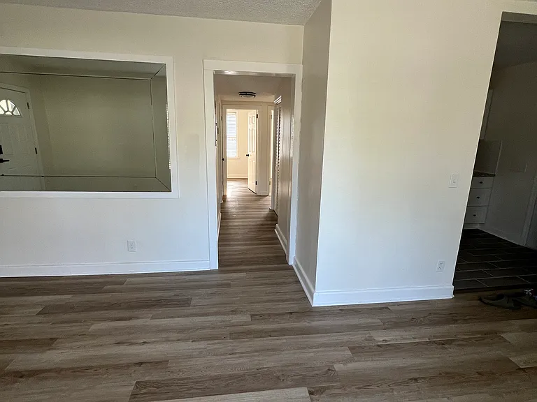 Hallway leading to bedrooms and bath.
