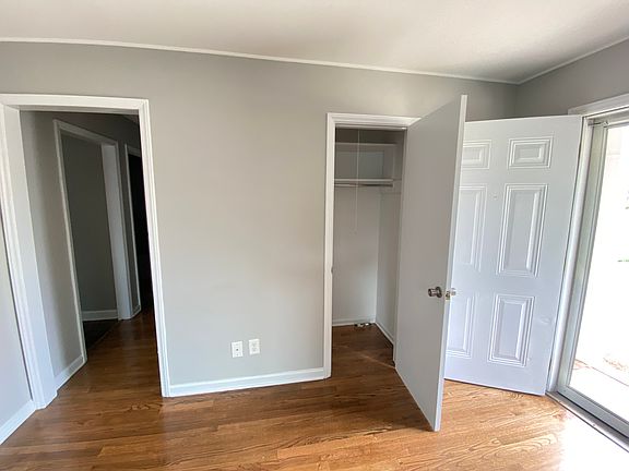 Coat closet in the living room and view to the hall way
