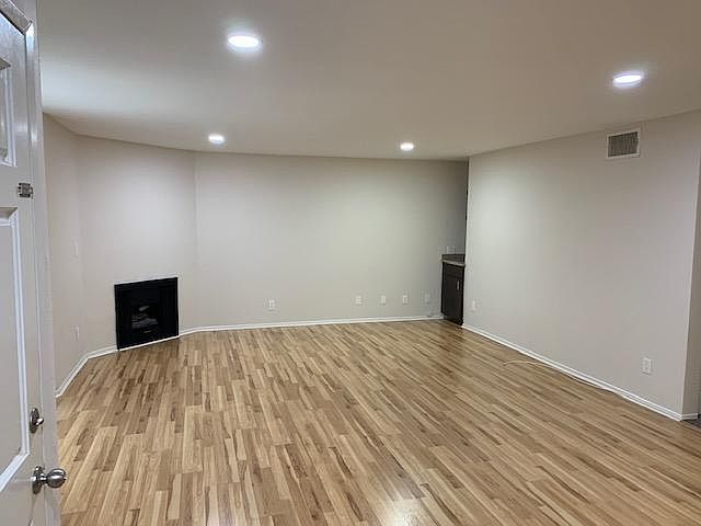 Spacious living room with working fireplace and wet bar.