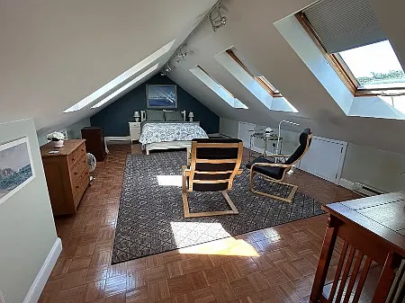 The apartment has two floors. The upper, 4th floor loft offers 7 skylights and quiet privacy. Ensuite bathroom, desk, and exercise bike are on the 4th floor as well, with a handy mini-fridge.
