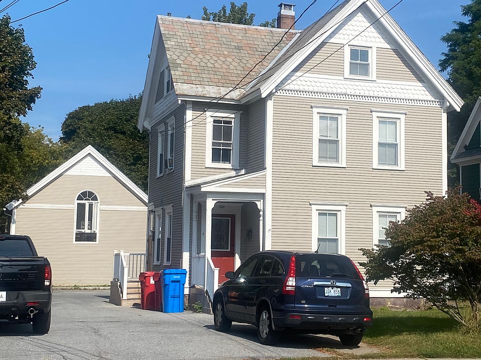 Apartment is top floor of front building.
