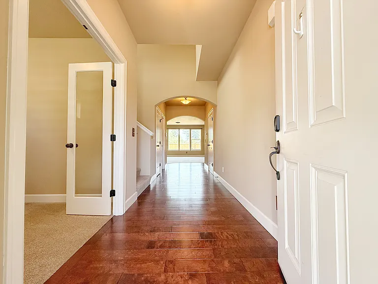 Entry looking in. Office and stairwell on left.