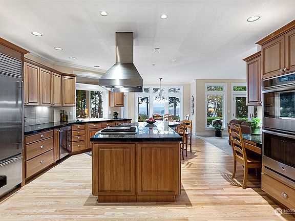 For the cook who delights in spending time in the kitchen, this one is for you. Thermador gas cooktop, Sub Zero refrigerator, stainless steel appliances surrounded by beautiful granite countertops.>