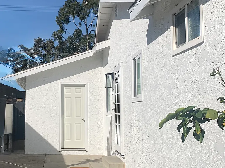 Convenient side entrance with a dedicated garage door staight ahead and a private home entry to the right proving direct access to the kitchen