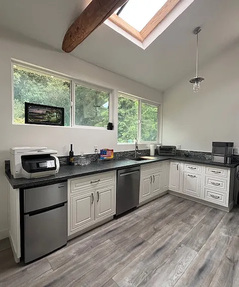 Upstairs entertainment area. Full size dishwasher and sink.