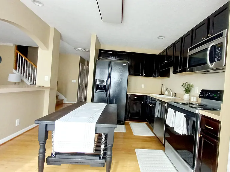 open kitchen with a lot of space to move around and plenty of counter space - does not includes island
