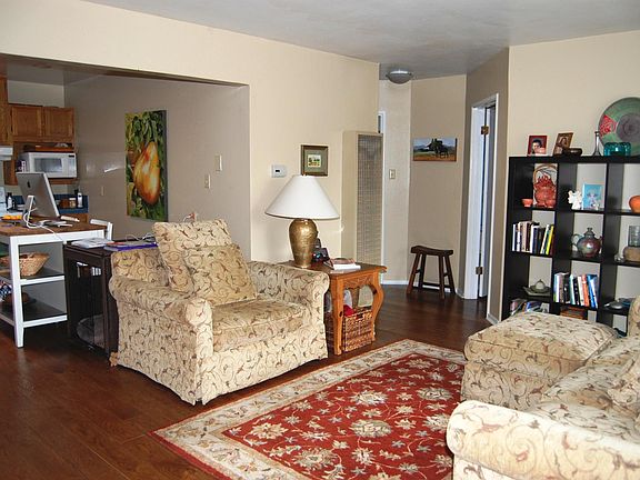 Living room and dining table in kitchen.