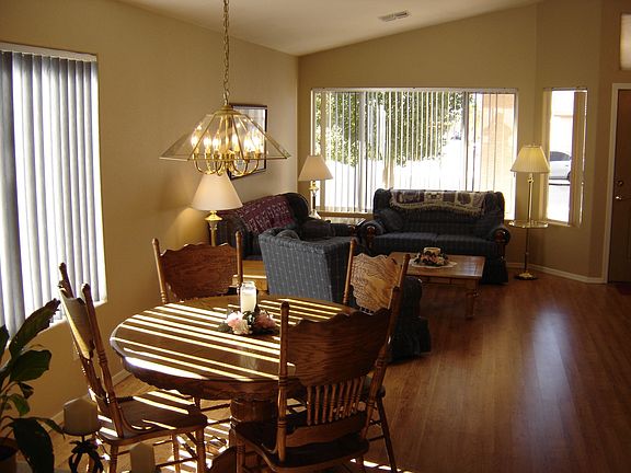 The formal living and dinibg area with new upgraded wood laminate flooring.