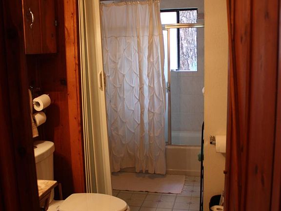 Bathroom with accordion door to separate tub/shower