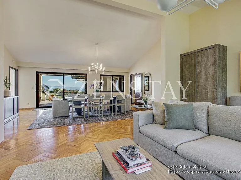Sun-filled living area designed for comfort, gathering, and easy entertaining