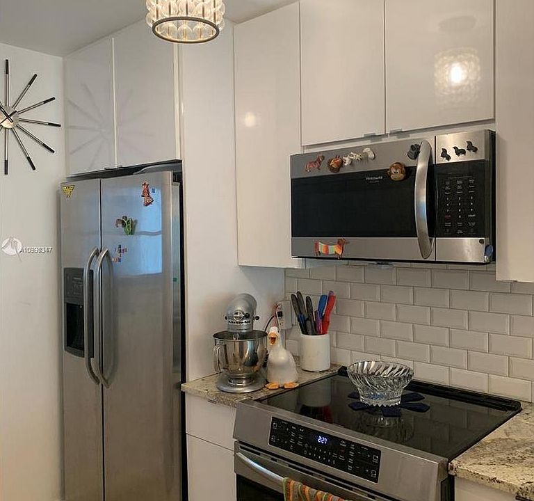 WINDOWED KITCHEN UPGRADE - Kitchen soffits removed to expand cabinets to the ceiling