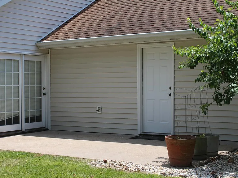 The large patio off the great room has access to the garage