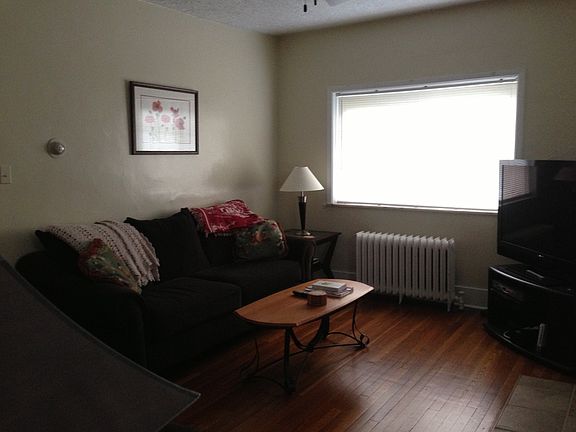 Large living room with gleaming hardwood floors