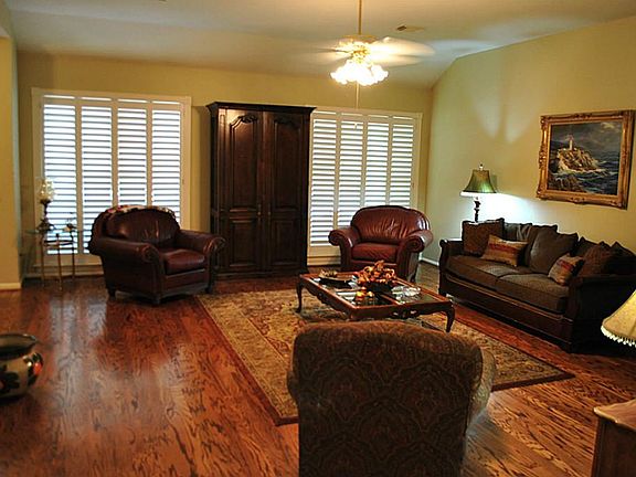 Another view of the family room showing the lovely plantation shutters