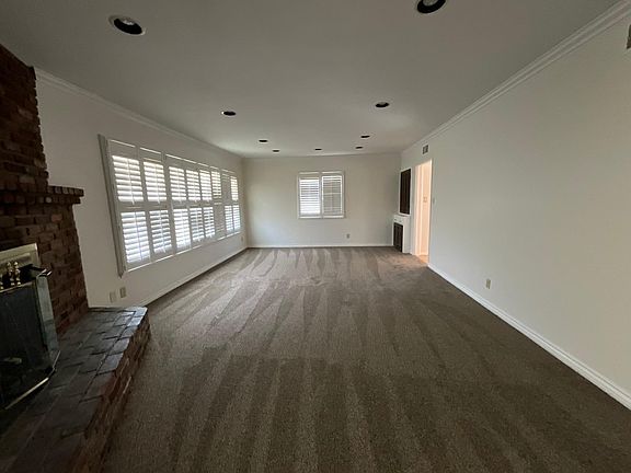 living room with dining and fireplace
