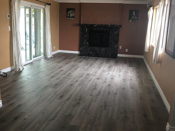 Family room w/ sliding door access to backyard