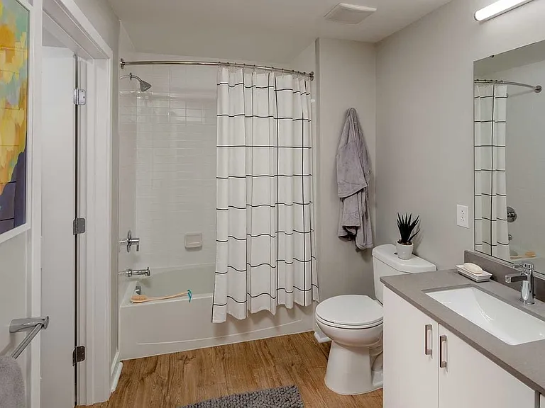 Design Collection I Bath with white cabinetry, grey quartz countertop, and hard surface flooring